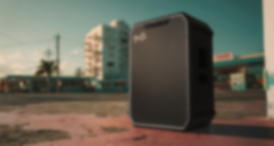 Fender x Teufel ROCKSTER NEO party speaker on a colorful surface, showcasing a classic design and robust sound.